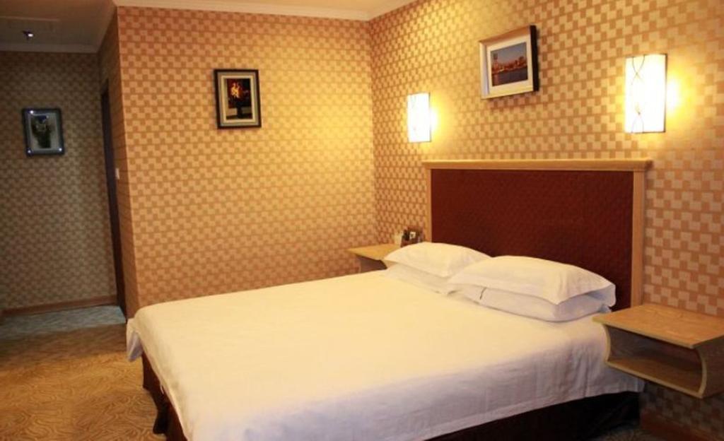 Omeiga Business Hotel Yiwu (Zhejiang) Zimmer foto
